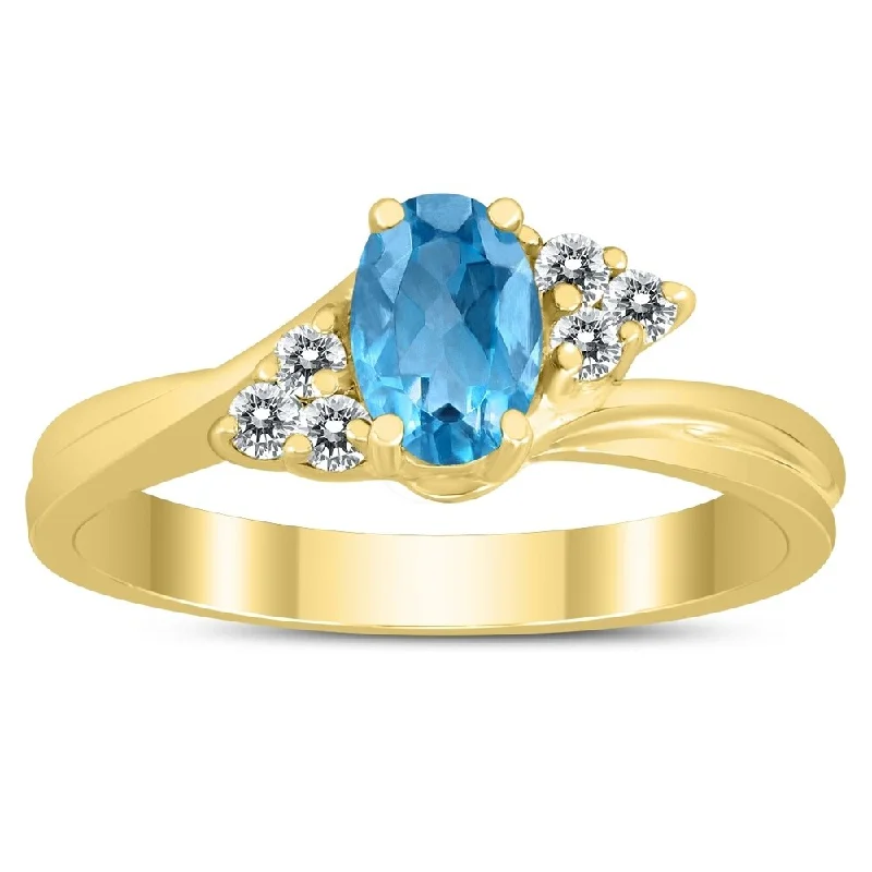 6X4MM Blue Topaz and Diamond Twist Ring in 10K Yellow Gold