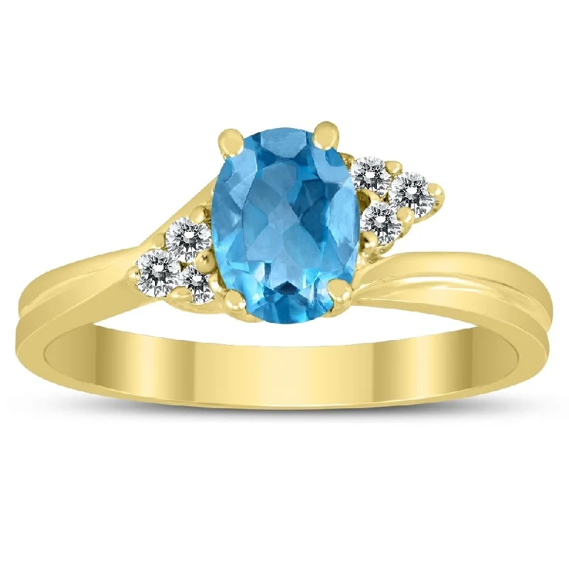 7X5MM Blue Topaz and Diamond Twist Ring in 10K Yellow Gold